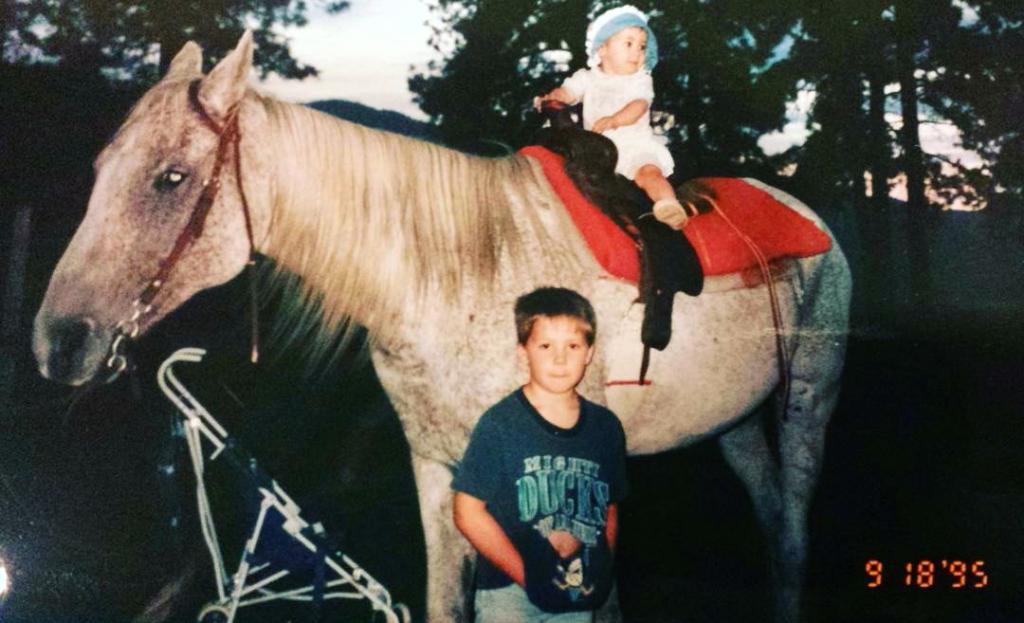 Kassie, barely 1 year old, with her older brother and their horse Cinco. (Courtesy of Kassie Guglielmino)